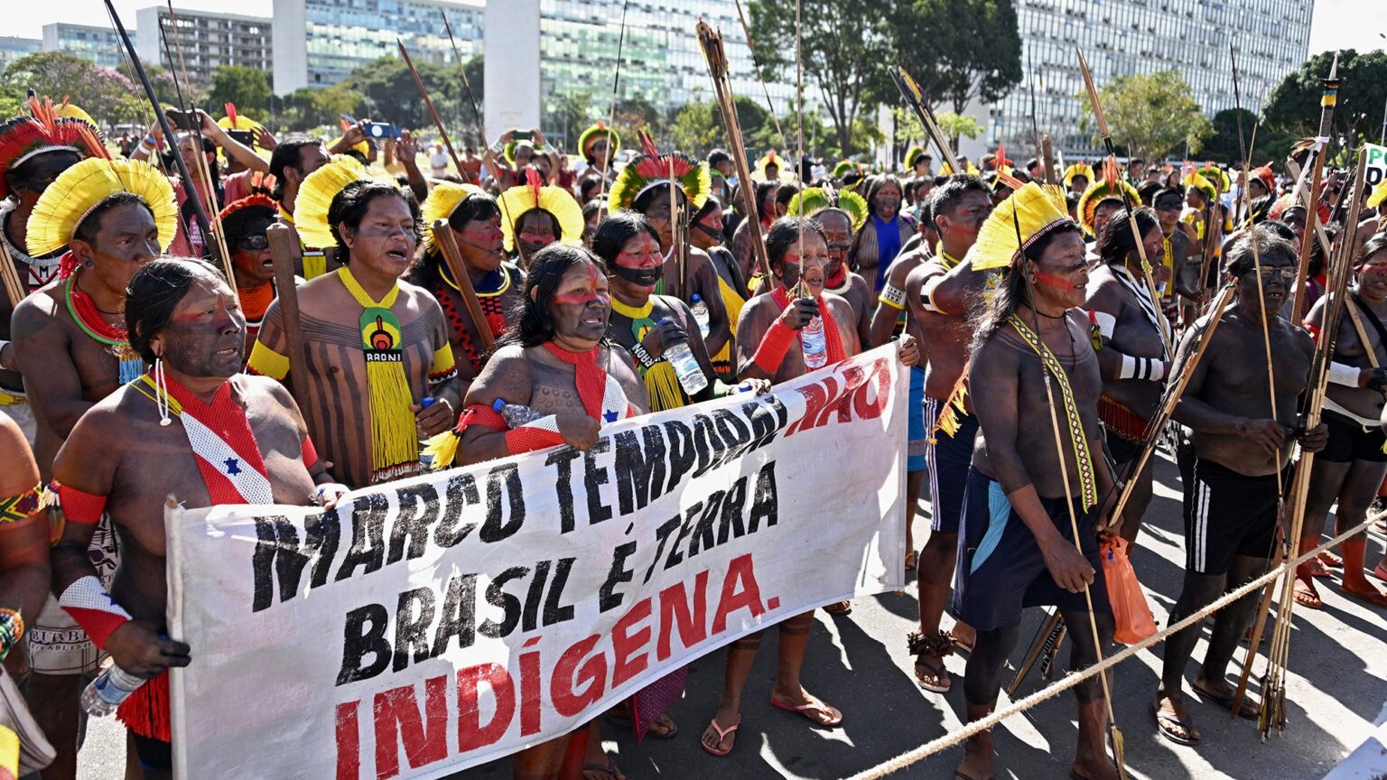 Brazilian Indigenous people from different tribes take part in a demonstration against the so-called legal thesis Marco Temporal (Temporal Milestone), a proposal that could jeopardize the protection of ancestral lands, a day before the country
