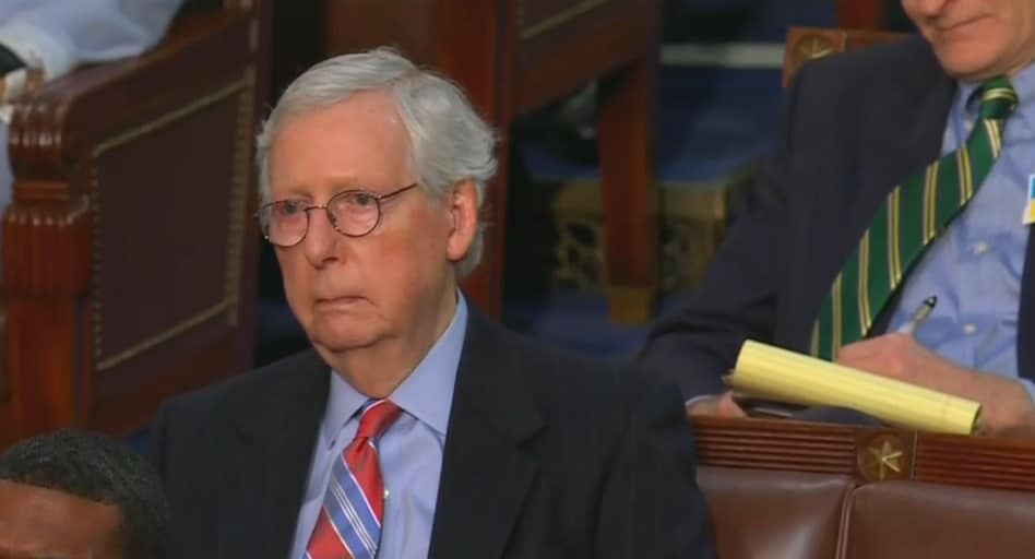 Mitch McConnell listens to Biden at the SOTU