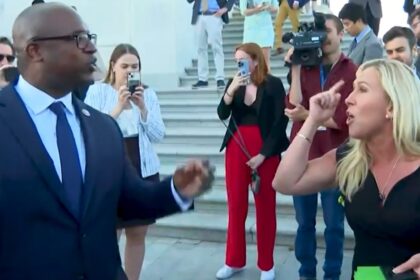 Jamaal Bowman and Marjorie Taylor Greene argue on the Capitol steps.