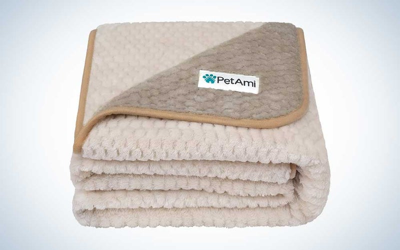 A lineup of the best dog blankets cut into four vertical panels